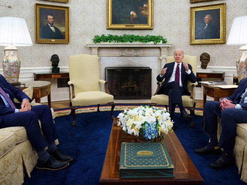 President Joe Biden, House Speaker Kevin McCarthy and Senate Majority Leader Chuck Schumer sitting in Oval office during meeting on debt ceiling.