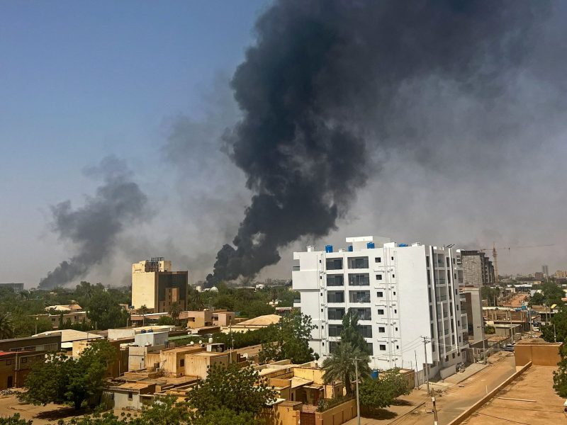 Smoke billows above residential buildings in Khartoum, Sudan