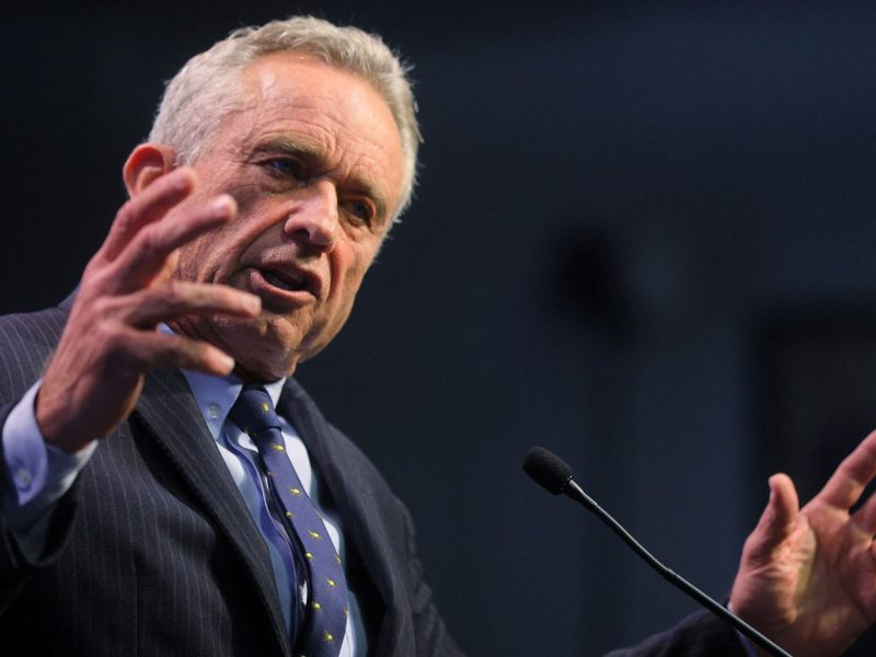 Robert F. Kennedy Jr. speaks in front of podium at St. Anselm College in Manchester, New Hampshire.